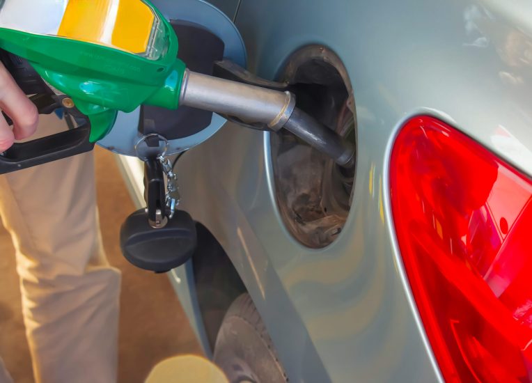 Refueling the car at a gas station fuel pump.
